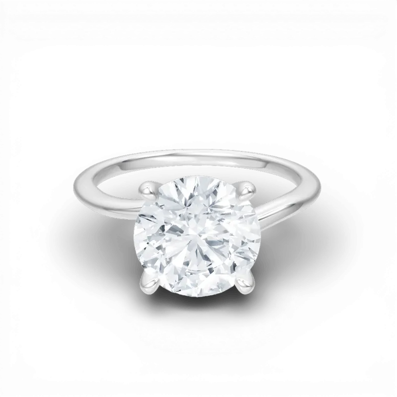 The Geneva Round Cut 14kt White Gold Four-Prong Solitaire Engagement Ring